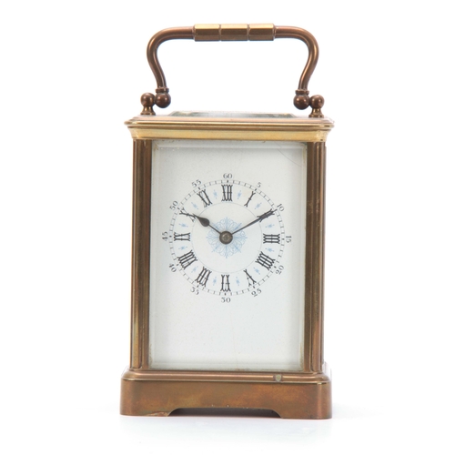 976 - A LATE 19TH CENTURY FRENCH BRASS STRIKING CARRIAGE CLOCK the corniche case with enamel dial and Roma... 