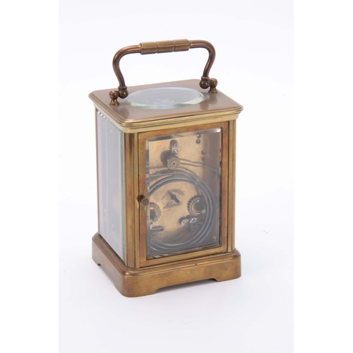 976 - A LATE 19TH CENTURY FRENCH BRASS STRIKING CARRIAGE CLOCK the corniche case with enamel dial and Roma... 