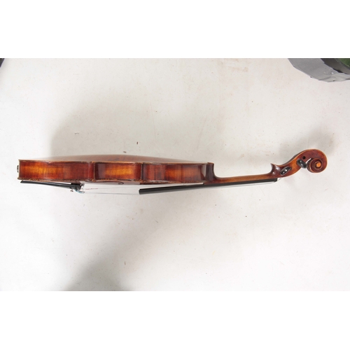 767 - AN ANTIQUE VIOLIN length of back 36cm - sold in a viola case with a bow.