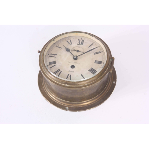 1089 - AN EARLY 20th CENTURY BRASS CASED SHIPS CLOCK with Roman dial fronting an eight-day spring driven mo... 