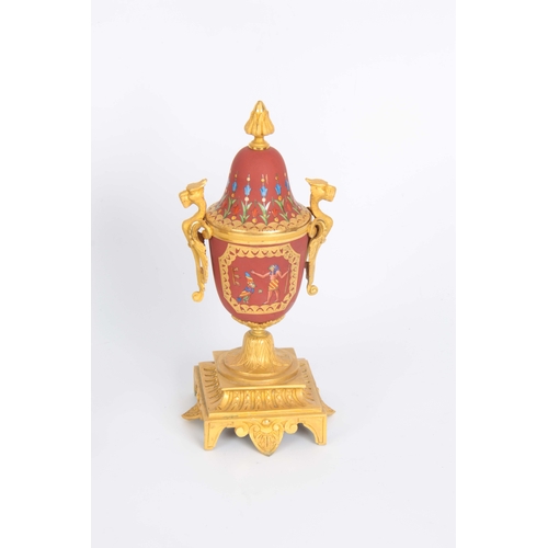 1091 - A LATE 19th CENTURY FRENCH EGYPTIAN STYLE ORMOLU AND PORCELAIN CLOCK GARNITURE the case surmounted b... 