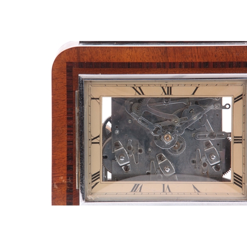 1106 - AN UNUSUAL ART DECO WALNUT QUARTER CHIMING MANTEL CLOCK possible made for an exhibition, the case ha... 