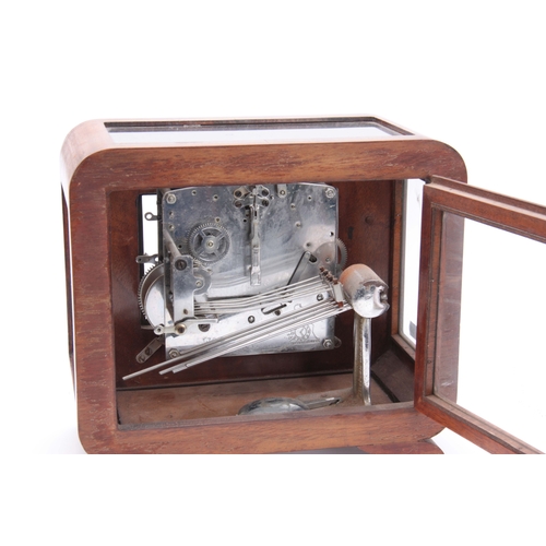 1106 - AN UNUSUAL ART DECO WALNUT QUARTER CHIMING MANTEL CLOCK possible made for an exhibition, the case ha... 