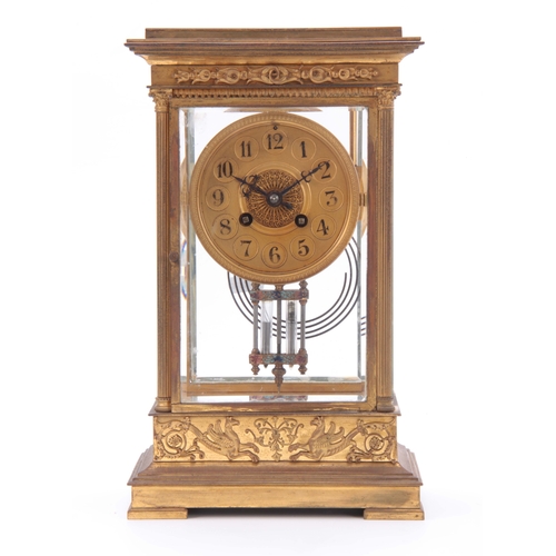 1108 - A LATE 19th CENTURY FRENCH GILT BRASS FOUR-GLASS MANTEL CLOCK the case with applied scroll-work, fol... 