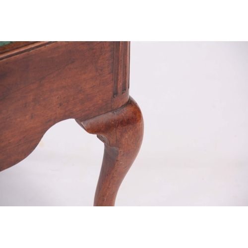 1114 - A GEORGE I WALNUT STOOL with shaped side rails, fluted corners and drop-in seat; standing on cabriol... 