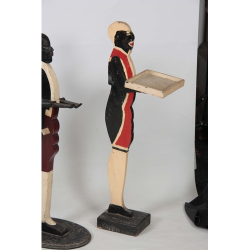 1120 - FOUR EARLY 20TH CENTURY FIGURAL DUMB WAITERS three decorated as blackamore figures and one decorated... 