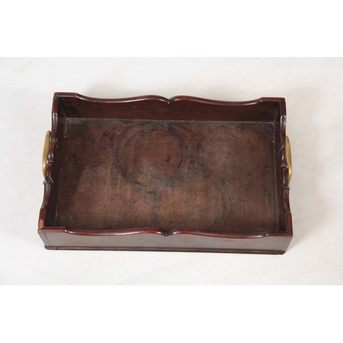 1121 - A GEORGE III MAHOGANY LIBRARY TRAY with shaped raised sides and fitted brass carrying handles 51cm 3... 