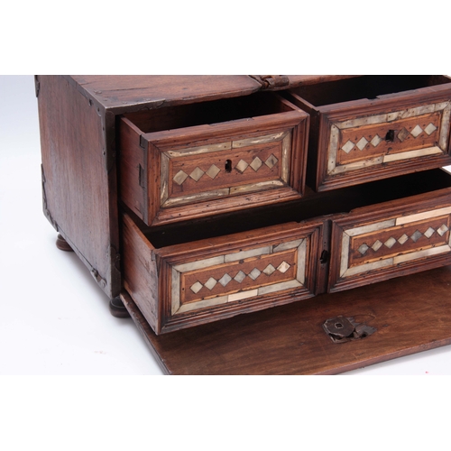 1126 - AN EARLY EASTERN EUROPEAN FRUITWOOD TABLE CASKET with ironwork straps and lock plate, the hinged dow... 