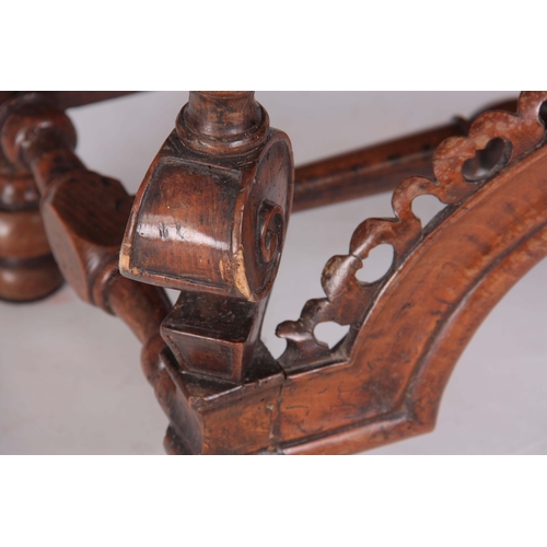 1131 - A LATE 17TH CENTURY WALNUT STOOL with square scroll shaped 'Horse Bone' cabriole leg supports joined... 