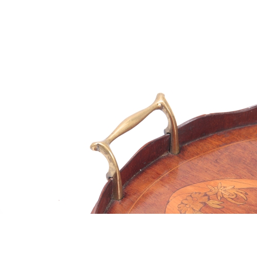 1132 - A 19TH CENTURY INLAID MAHOGANY OVAL TRAY with brass side handles and wavey edge gallery 71cm wide 46... 