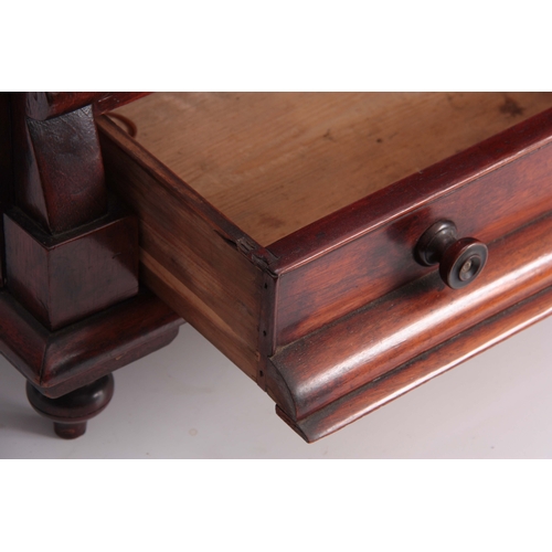 1133 - A 19TH CENTURY MAHOGANY MINIATURE CHEST OF DRAWERS with cushion-shaped secret top drawer above two s... 