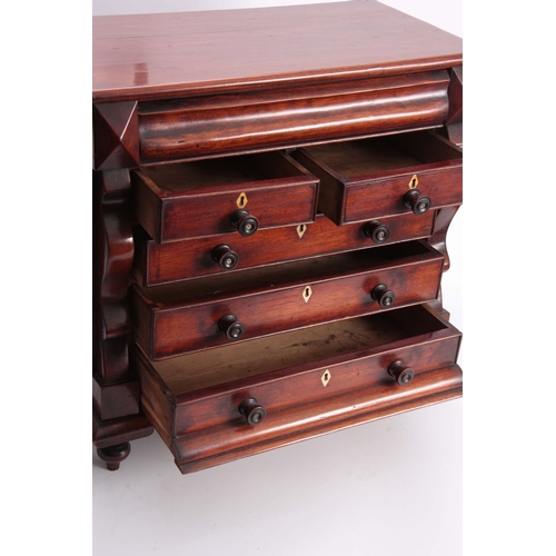 1133 - A 19TH CENTURY MAHOGANY MINIATURE CHEST OF DRAWERS with cushion-shaped secret top drawer above two s... 