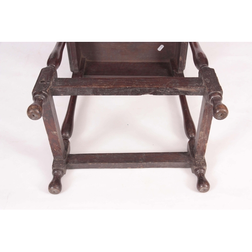 1134 - A 18TH CENTURY JOINED OAK STOOL with nailed top on a slender splayed baluster turned base with raise... 