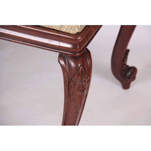 1135 - A PAIR OF LATE REGENCY ROSEWOOD STOOLS with upholstered cushion tops; standing on carved cabriole le... 