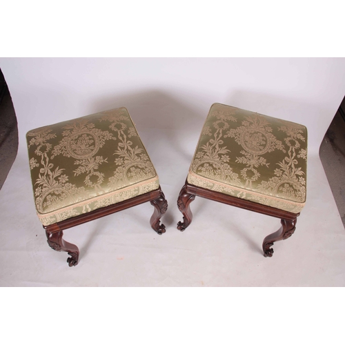 1135 - A PAIR OF LATE REGENCY ROSEWOOD STOOLS with upholstered cushion tops; standing on carved cabriole le... 