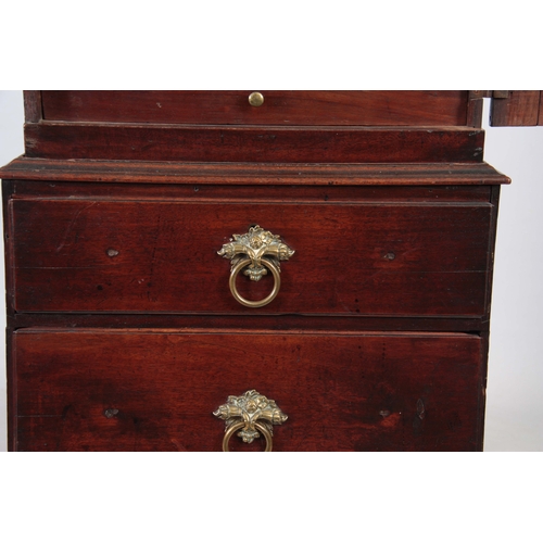 1142 - AN EARLY 18TH CENTURY WALNUT SPICE CUPBOARD ON CHEST having a shaped panelled top door revealing a b... 