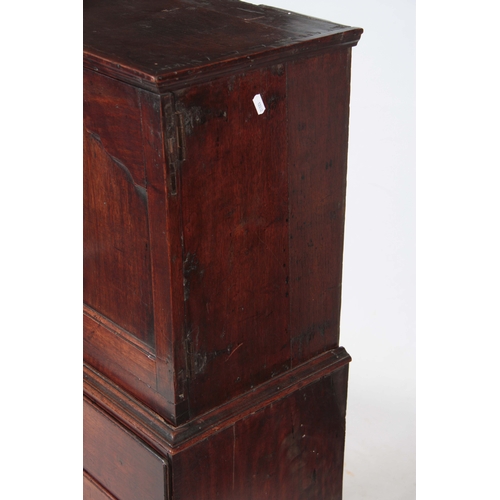 1142 - AN EARLY 18TH CENTURY WALNUT SPICE CUPBOARD ON CHEST having a shaped panelled top door revealing a b... 