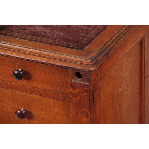 1145 - GILLOWS, LANCASTER.  AN EARLY 19TH CENTURY OAK PARTNERS DESK with original tooled leather top with r... 