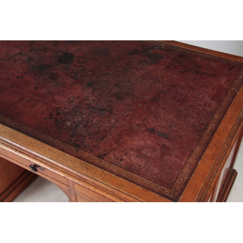 1145 - GILLOWS, LANCASTER.  AN EARLY 19TH CENTURY OAK PARTNERS DESK with original tooled leather top with r... 