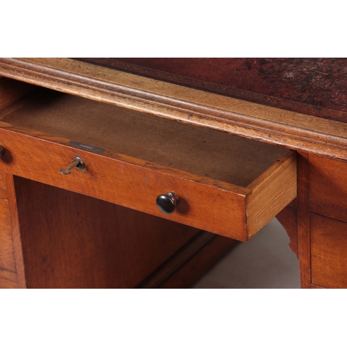 1145 - GILLOWS, LANCASTER.  AN EARLY 19TH CENTURY OAK PARTNERS DESK with original tooled leather top with r... 