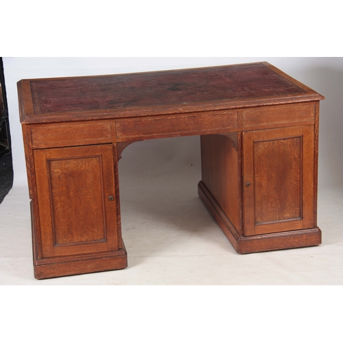 1145 - GILLOWS, LANCASTER.  AN EARLY 19TH CENTURY OAK PARTNERS DESK with original tooled leather top with r... 