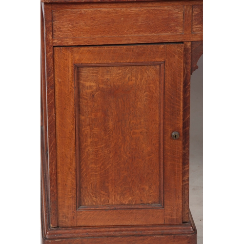 1145 - GILLOWS, LANCASTER.  AN EARLY 19TH CENTURY OAK PARTNERS DESK with original tooled leather top with r... 