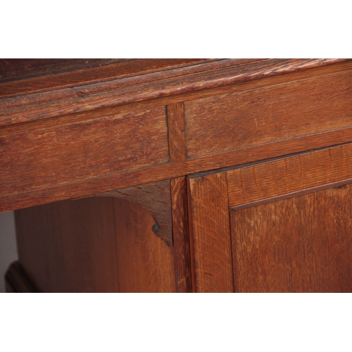 1145 - GILLOWS, LANCASTER.  AN EARLY 19TH CENTURY OAK PARTNERS DESK with original tooled leather top with r... 