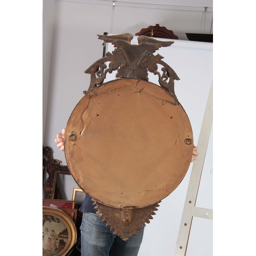 1147 - AN IMPRESSIVE REGENCY CONVEX CARVED GILT GESSO MIRROR OF LARGE SCALE having a 22