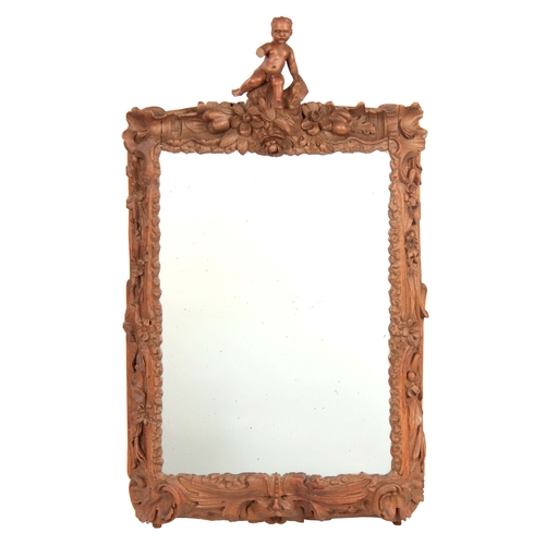 1149 - AN 18TH CENTURY CONTINENTAL FINELY CARVED OAK HANGING MIRROR with rococo shaped leaf carved frame ha... 