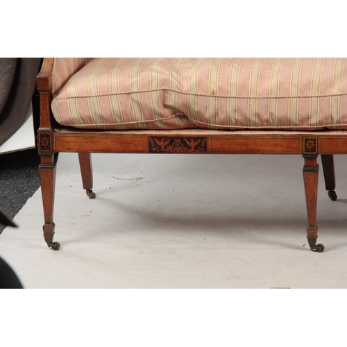 1150 - A REGENCY SATINWOOD THREE SEATER SETTEE with painted decoration, standing on square tapering legs wi... 