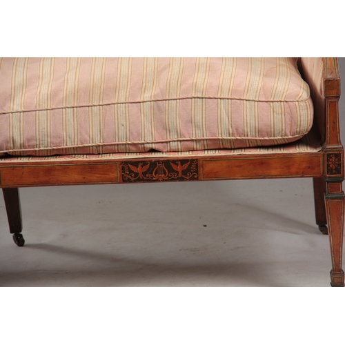 1150 - A REGENCY SATINWOOD THREE SEATER SETTEE with painted decoration, standing on square tapering legs wi... 