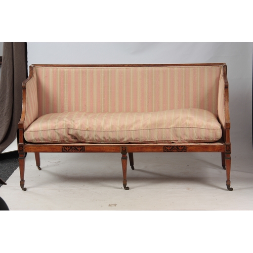 1150 - A REGENCY SATINWOOD THREE SEATER SETTEE with painted decoration, standing on square tapering legs wi... 