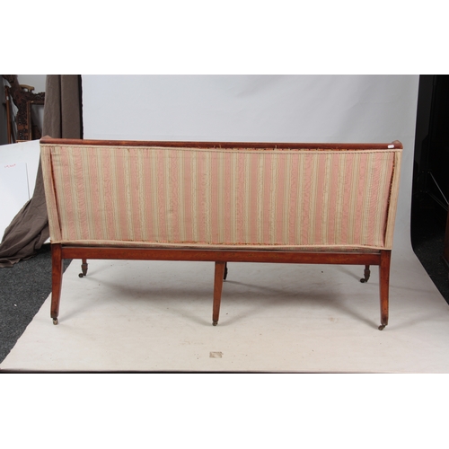 1150 - A REGENCY SATINWOOD THREE SEATER SETTEE with painted decoration, standing on square tapering legs wi... 