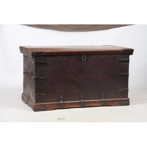 1151 - AN 18TH CENTURY WALNUT OFFICERS TRUNK with iron mounted corners and strapped sides with carrying han... 