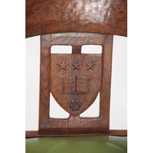 1154 - AN EARLY  ROBERT 'MOUSEMAN' THOMPSON OAK MONKS CHAIR with hooped arms and carved masks to the backre... 