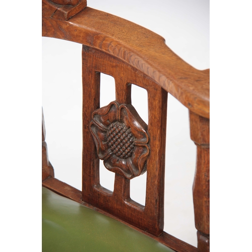 1154 - AN EARLY  ROBERT 'MOUSEMAN' THOMPSON OAK MONKS CHAIR with hooped arms and carved masks to the backre... 