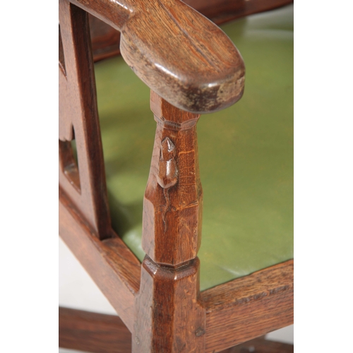 1154 - AN EARLY  ROBERT 'MOUSEMAN' THOMPSON OAK MONKS CHAIR with hooped arms and carved masks to the backre... 