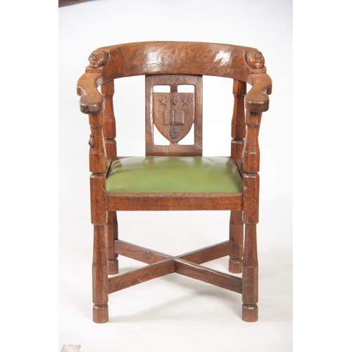 1154 - AN EARLY  ROBERT 'MOUSEMAN' THOMPSON OAK MONKS CHAIR with hooped arms and carved masks to the backre... 