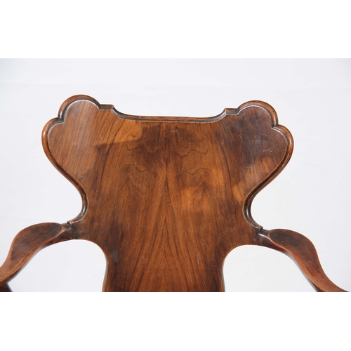 1156 - AN EARLY 20TH CENTURY WALNUT OPEN ARMCHAIR IN THE MANER OF GILLOWS with figured shaped back splat, s... 