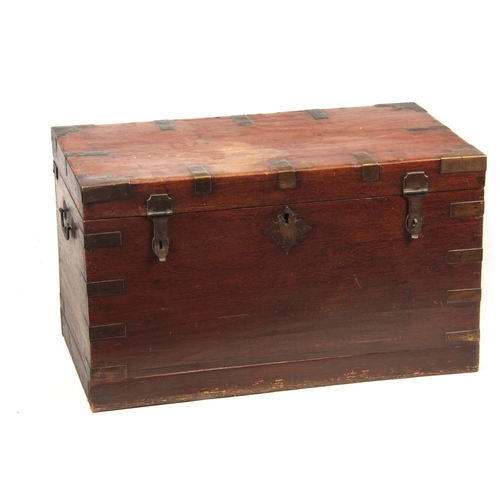 1158 - A 19TH CENTURY COLONIAL ANGLO INDIAN TEAK OFFICERS TRUNK having brass mounted corners and double-loc... 