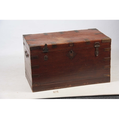 1158 - A 19TH CENTURY COLONIAL ANGLO INDIAN TEAK OFFICERS TRUNK having brass mounted corners and double-loc... 