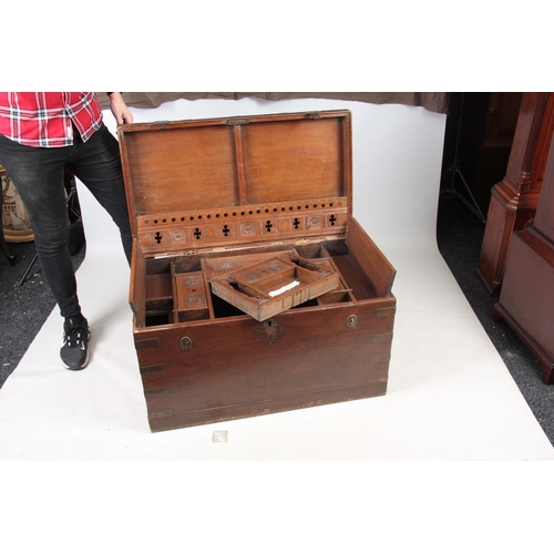 1158 - A 19TH CENTURY COLONIAL ANGLO INDIAN TEAK OFFICERS TRUNK having brass mounted corners and double-loc... 