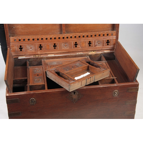 1158 - A 19TH CENTURY COLONIAL ANGLO INDIAN TEAK OFFICERS TRUNK having brass mounted corners and double-loc... 