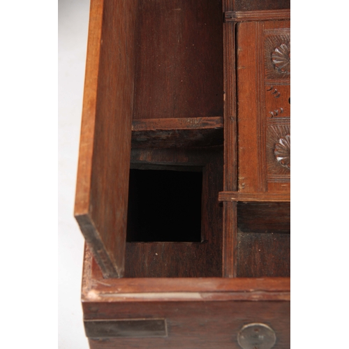 1158 - A 19TH CENTURY COLONIAL ANGLO INDIAN TEAK OFFICERS TRUNK having brass mounted corners and double-loc... 