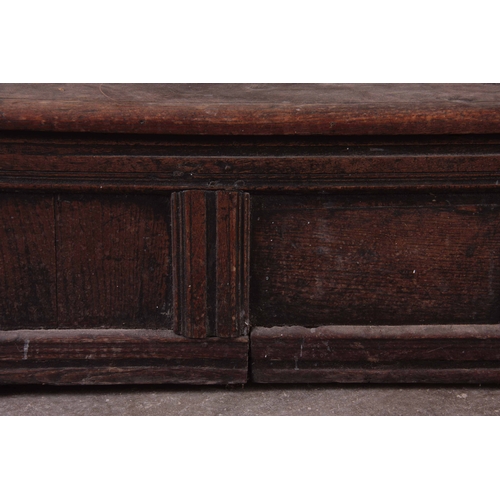 1159 - A RARE OVERSIZED 17TH CENTURY AND LATER JOINED OAK BOX SETTLE with an arcaded carved top rail, panel... 