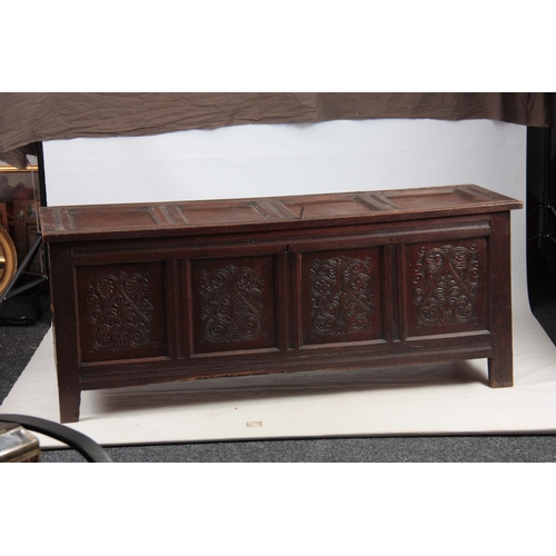 1160 - A 17TH CENTURY JOINED OAK FOUR PLANK WESTMORELAND COFFER with hinged lid above four carved scrolled ... 