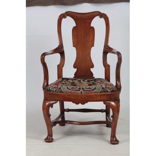 1163 - A GEORGE I WALNUT OPEN ARMCHAIR with scrolled top rail above a shaped back splat joined by shepherds... 