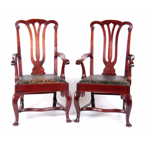 1166 - A LARGE PAIR OF GEORGE I STYLE WALNUT ARMCHAIRS with scroll carved open pierced back splats, open cr... 