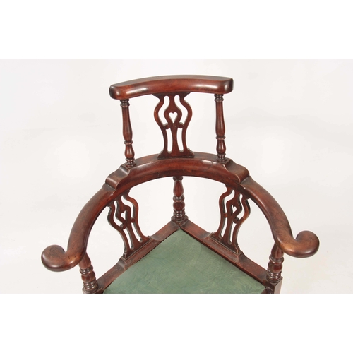 1170 - A GEORGE II WALNUT CORNER CHAIR with shaped back having pierced back splats raised by turned support... 