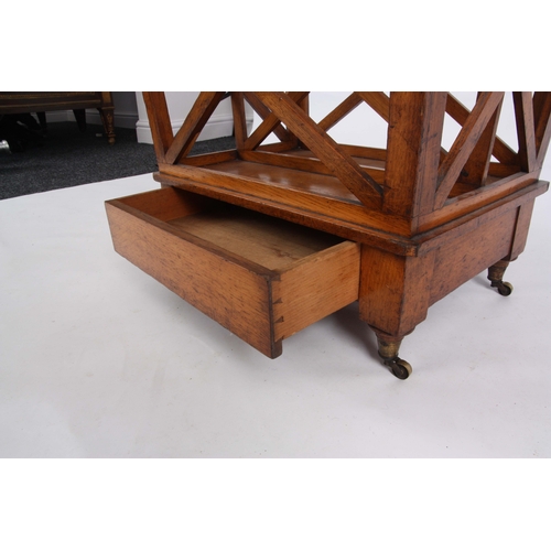 1176 - A STYLISH LATE 19TH CENTURY HONEY COLOURED OAK CANTERBURY with three X shaped book divides and ... 